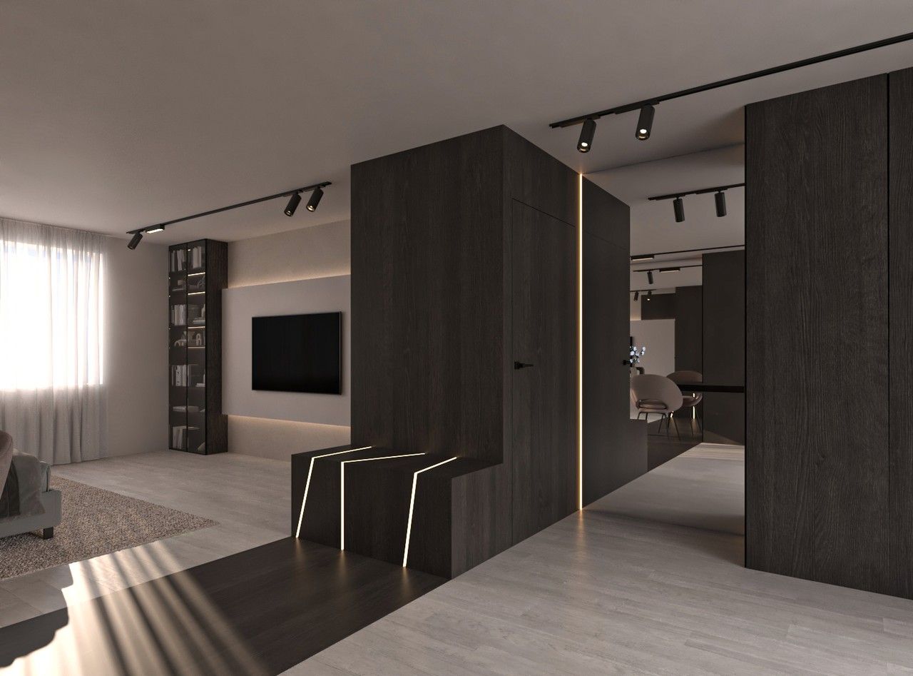 Espace de circulation intérieur avec banquette intégrée, boiseries foncées et éclairage discret.