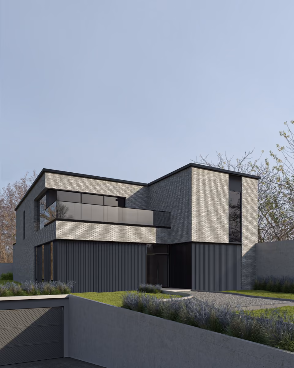 Maison en brique grise au-dessus d'un rez-de-chaussée en bardage sombre.