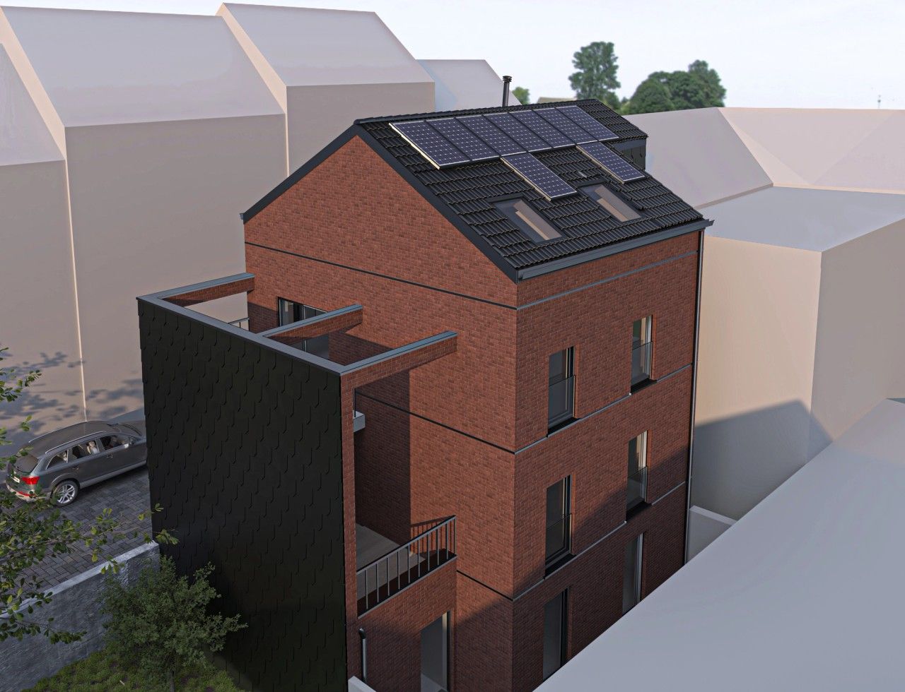 Vue aérienne arrière d’un immeuble neuf de 3 appartements à Verviers, montrant les terrasses, la toiture à deux versants et les panneaux photovoltaïques.