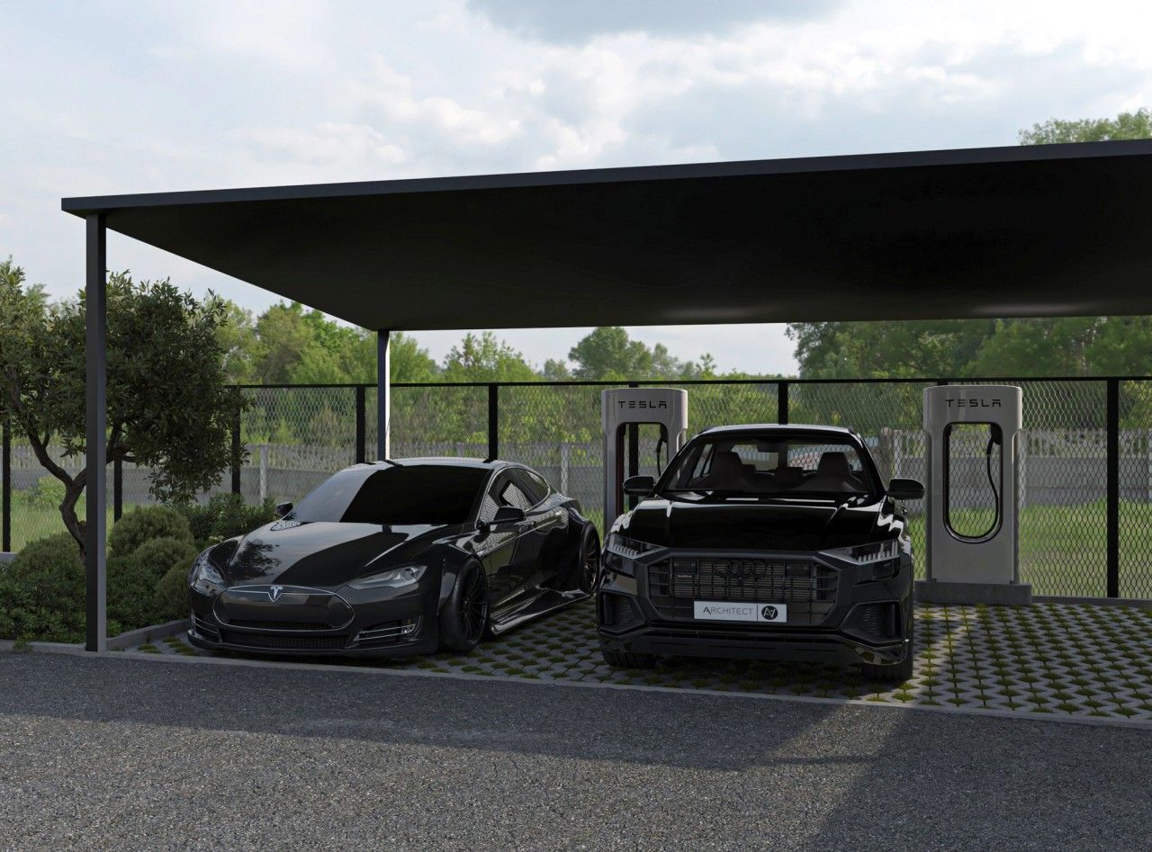 Carport aménagé à Grivegnée avec deux véhicules stationnés, structure métallique noire, sol drainant et bornes de recharge pour voitures électriques.
