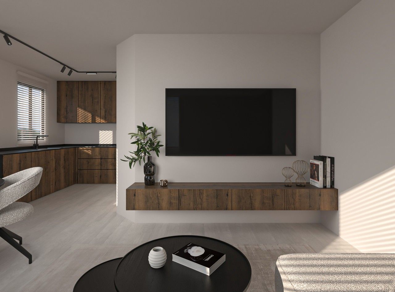 Vue du séjour rénové à Herstal avec télévision murale, meuble suspendu en bois et cuisine ouverte visible en arrière-plan.