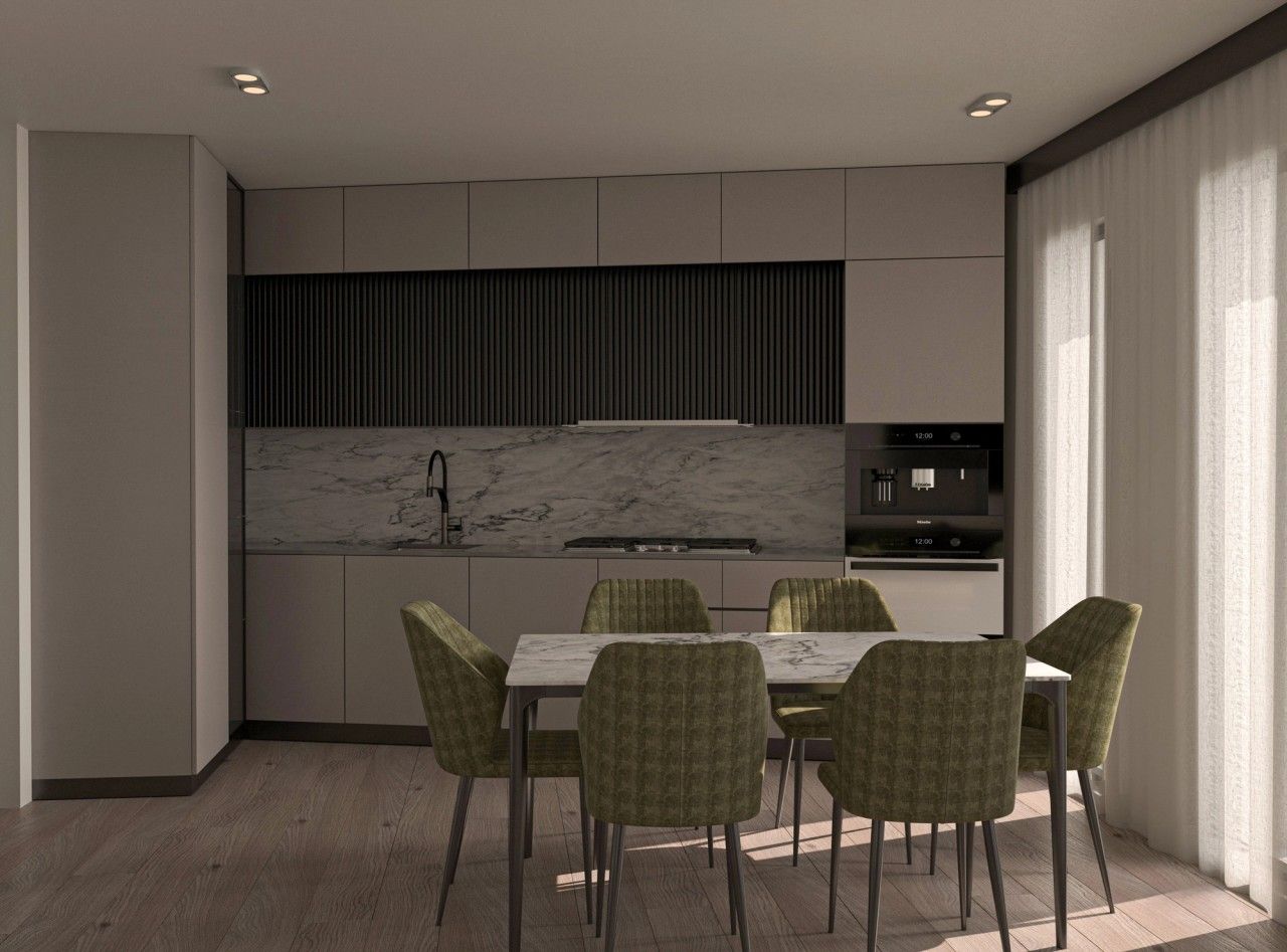 Vue intérieure de la cuisine contemporaine avec mobilier épuré, crédence effet marbre, colonnes intégrées et table à manger entourée de chaises en velours vert.