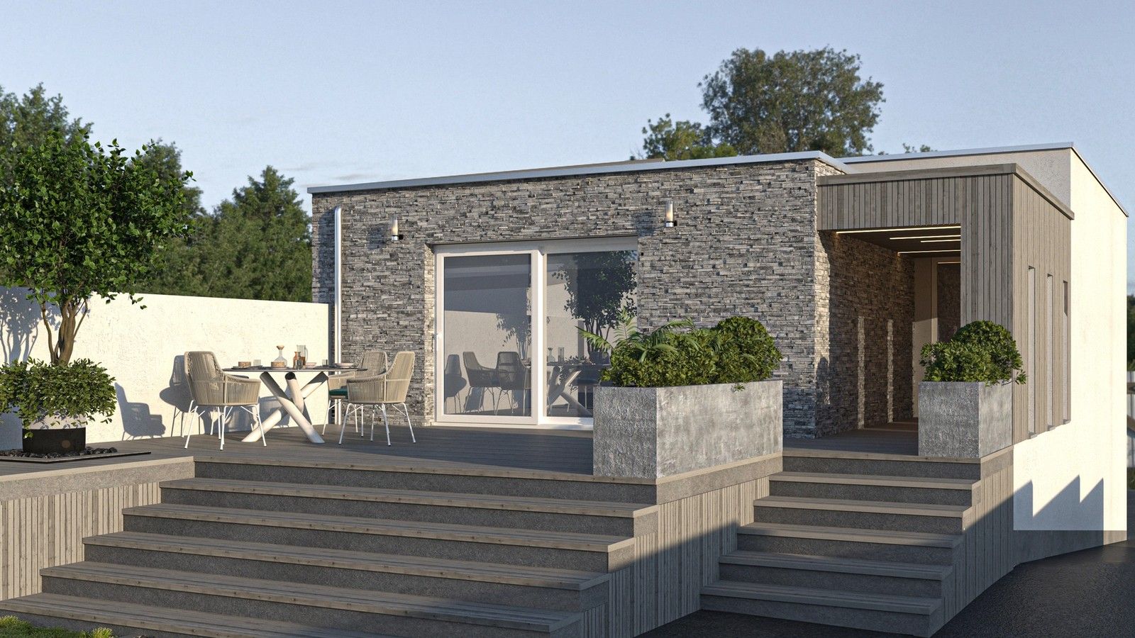 Façade arrière rénovée d’une maison unifamiliale à Engis, avec parement en pierre, terrasse en bois, larges baies vitrées et volume d’entrée habillé de bois.