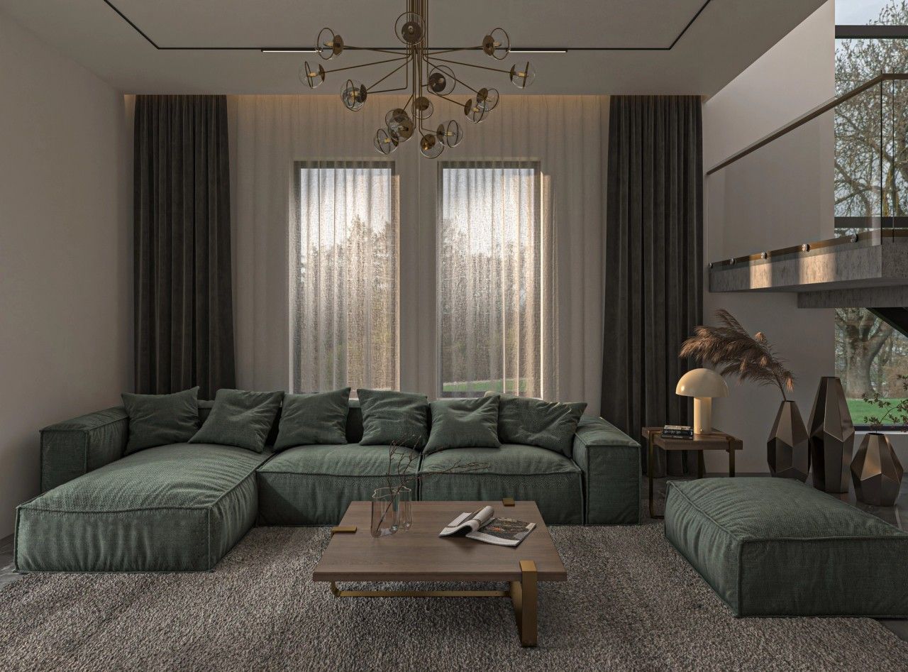 Vue du séjour d’un appartement contemporain à Verviers, avec grand canapé vert, table basse en bois, rideaux pleine hauteur et éclairage décoratif suspendu.