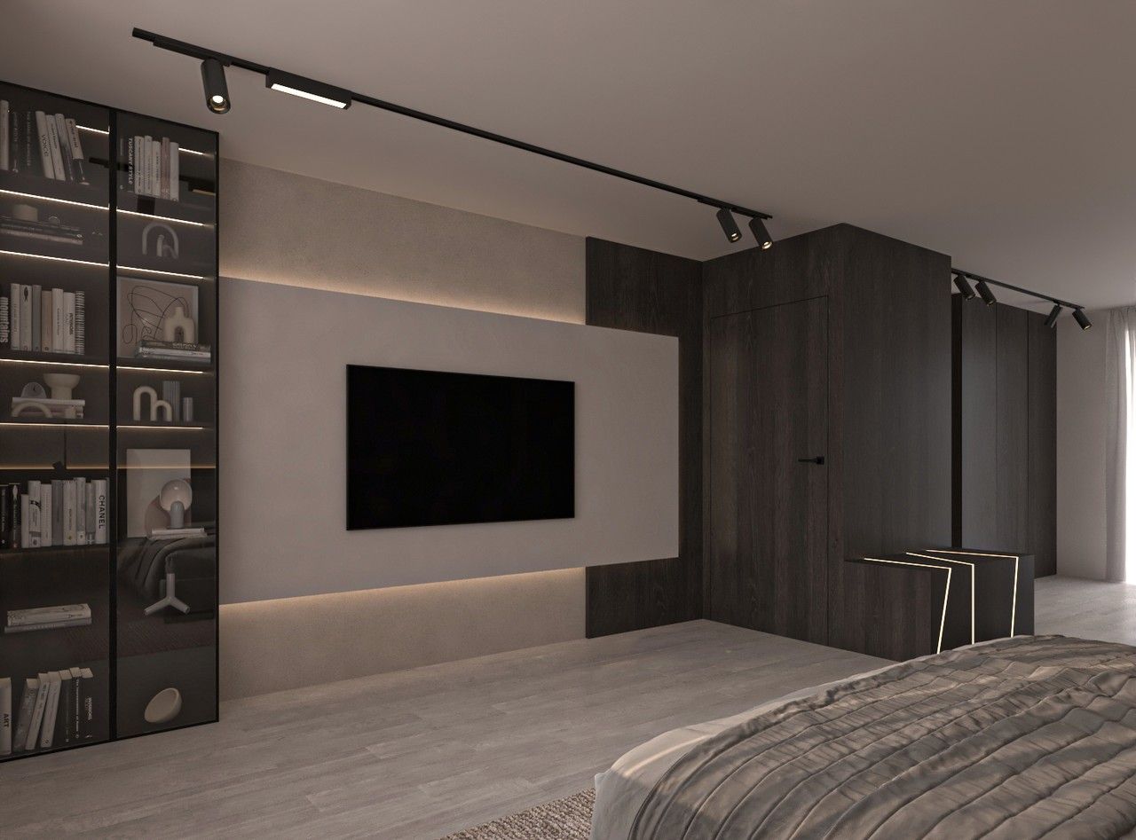 Vue latérale de la chambre avec mur TV, boiseries foncées et menuiseries intégrées.