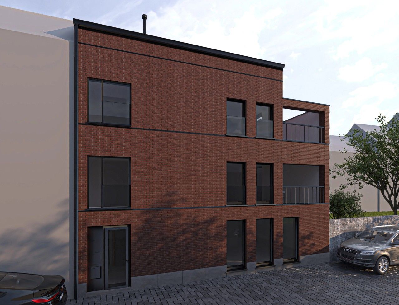 Façade principale d’un immeuble résidentiel neuf à Verviers comprenant 3 appartements QZEN et des terrasses en retrait.