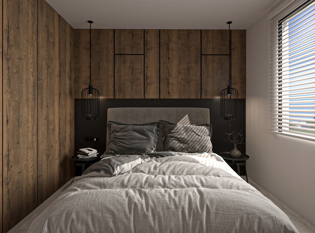 Vue frontale de la chambre parentale à Herstal, avec lit double, rangements intégrés en bois, tête de lit sombre et suspensions contemporaines.