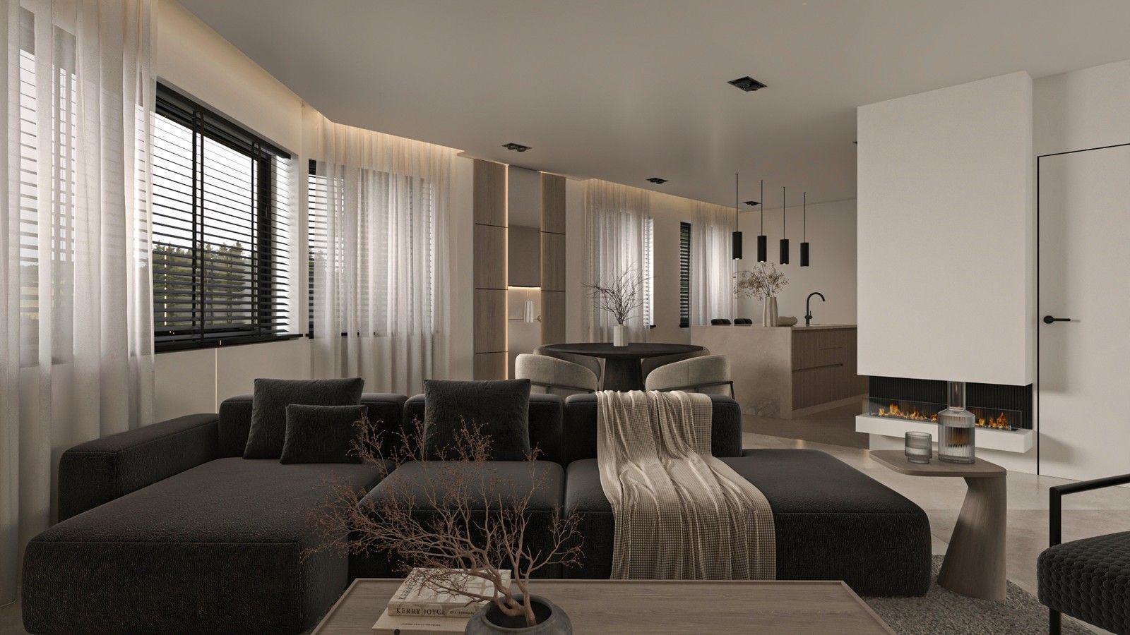 Vue d’ensemble du séjour d’un appartement rénové à Liège, avec canapé d’angle sombre, cheminée contemporaine, salle à manger et cuisine ouverte en arrière-plan.