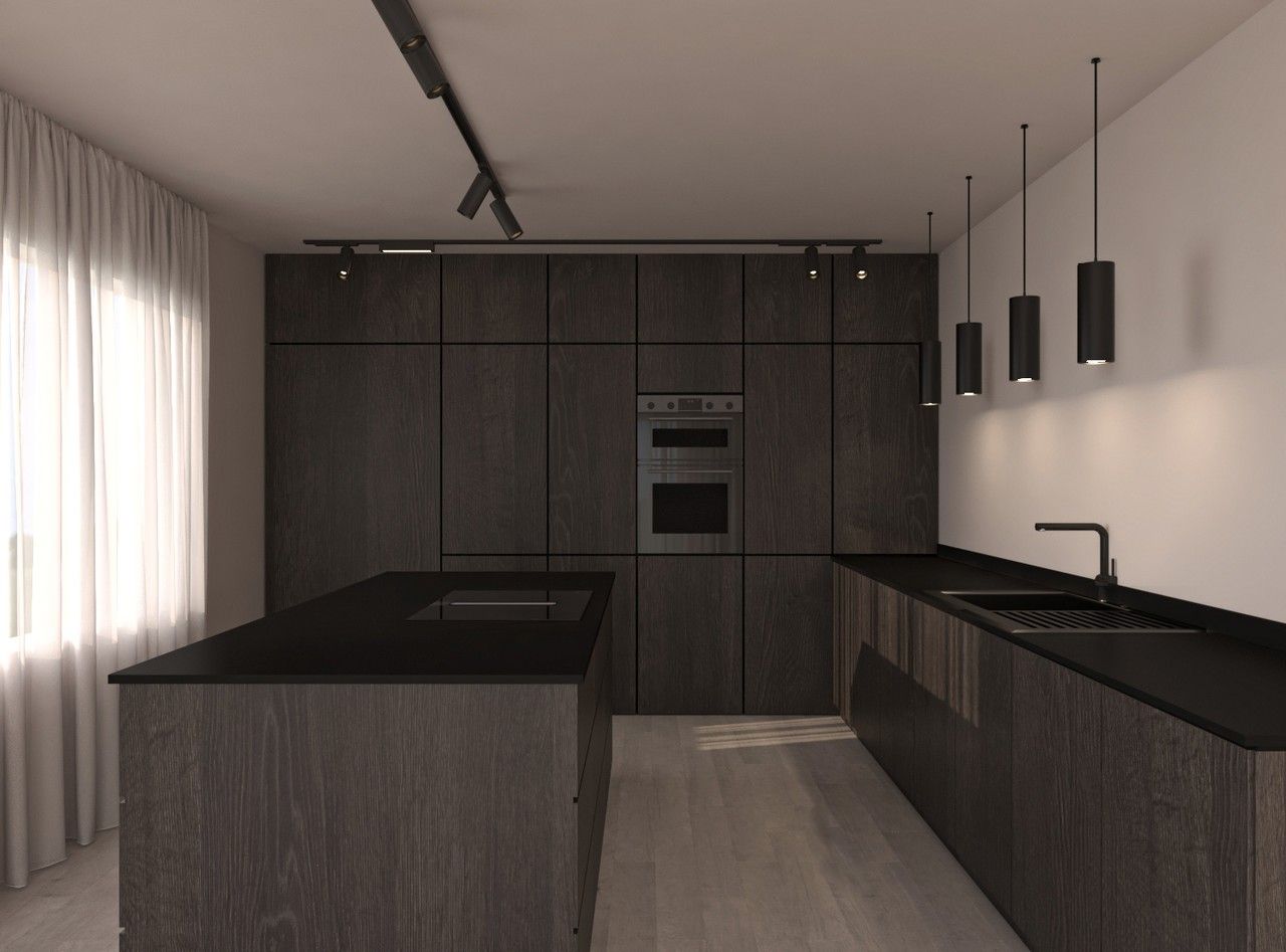 Vue frontale de la cuisine avec mobilier intégré, îlot central et éclairage suspendu.