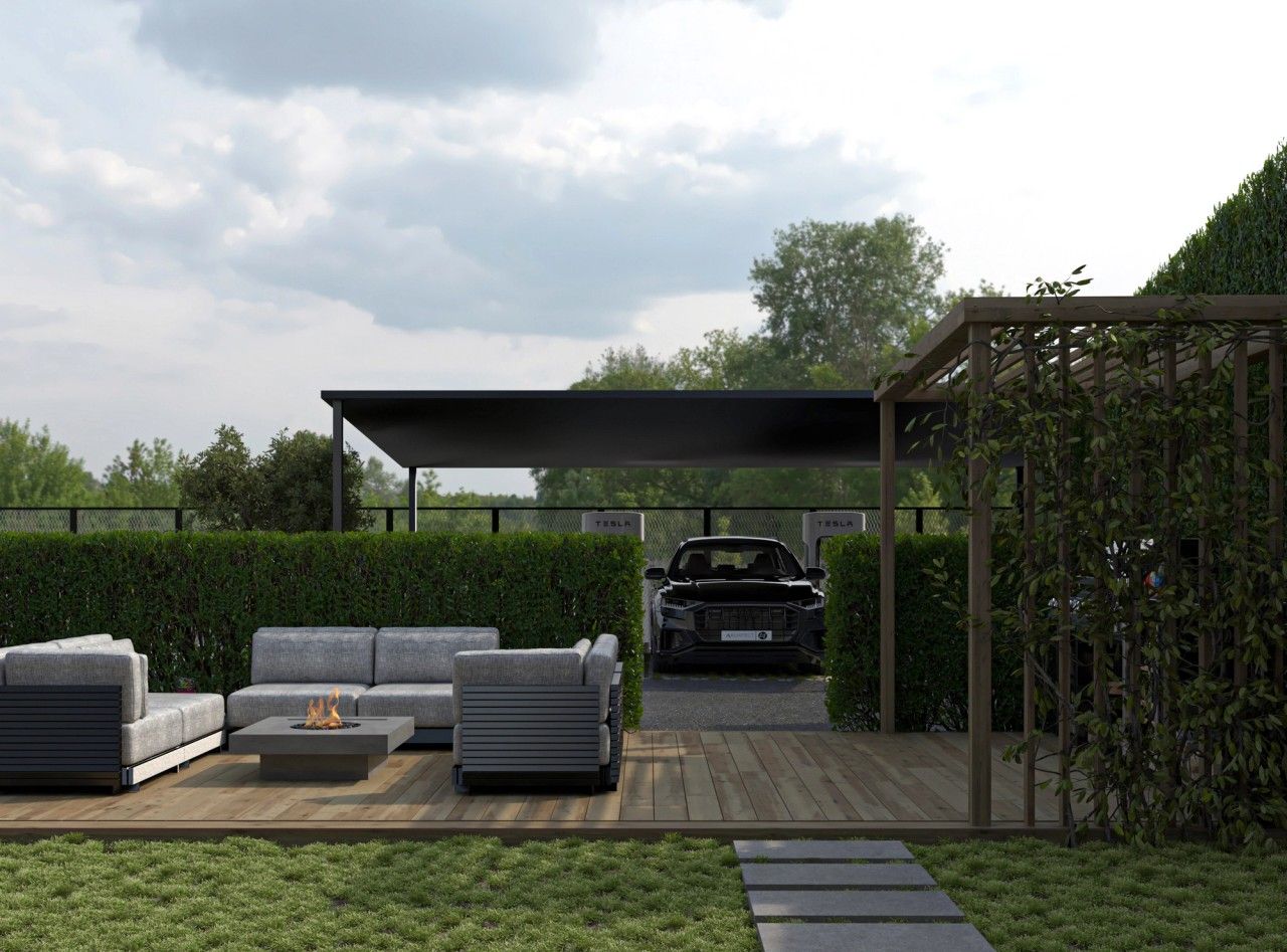 Aménagement extérieur d’un immeuble résidentiel à Grivegnée avec terrasse en bois, espace lounge, végétation, carport et bornes de recharge.