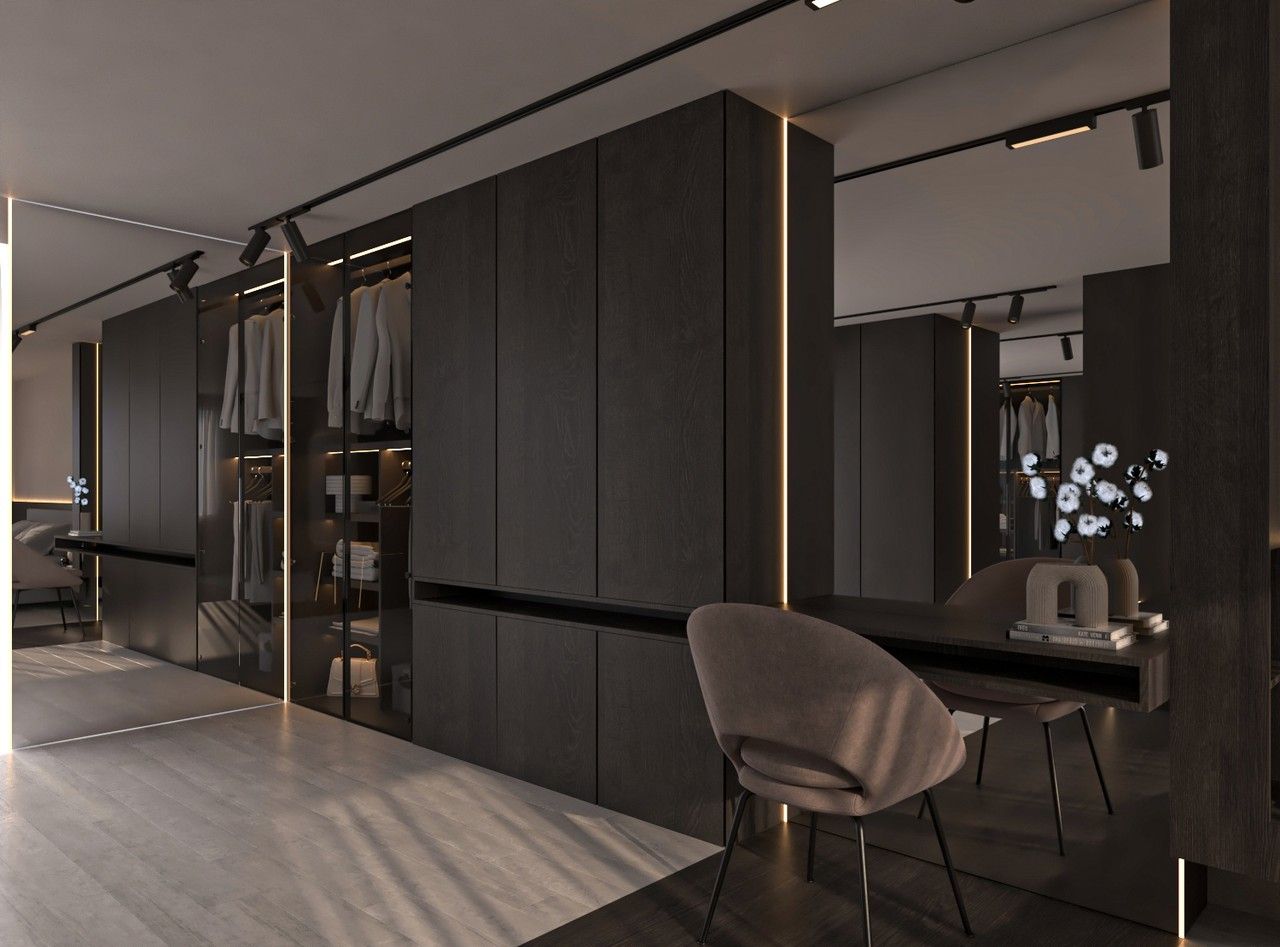 Perspective du dressing avec coiffeuse, éclairage linéaire et menuiseries foncées.